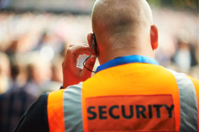 Event security wearing an orange vest